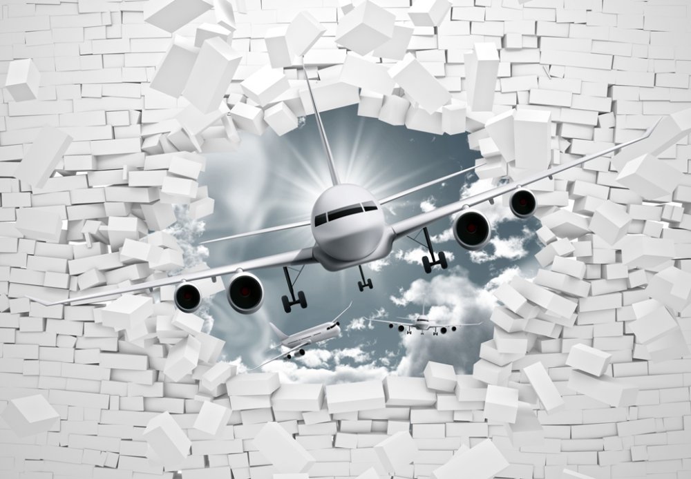 Самолет на фоне кирпичной стены